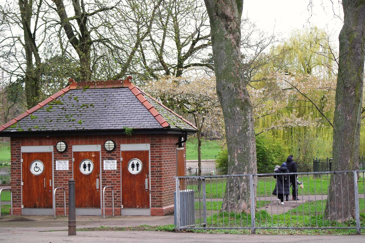 Public restroom building in front of a nice park