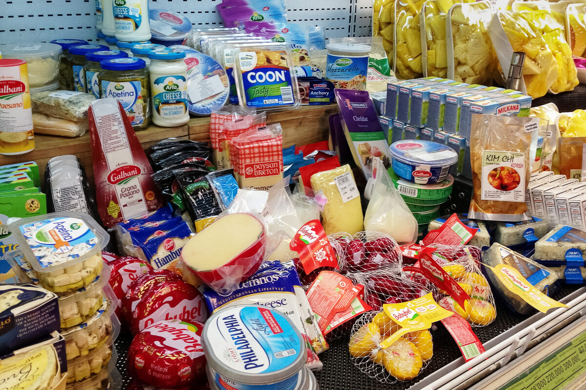 An overflowing bag of groceries on a counter
